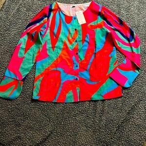 Woman’s psychedelic print button up top and skirt